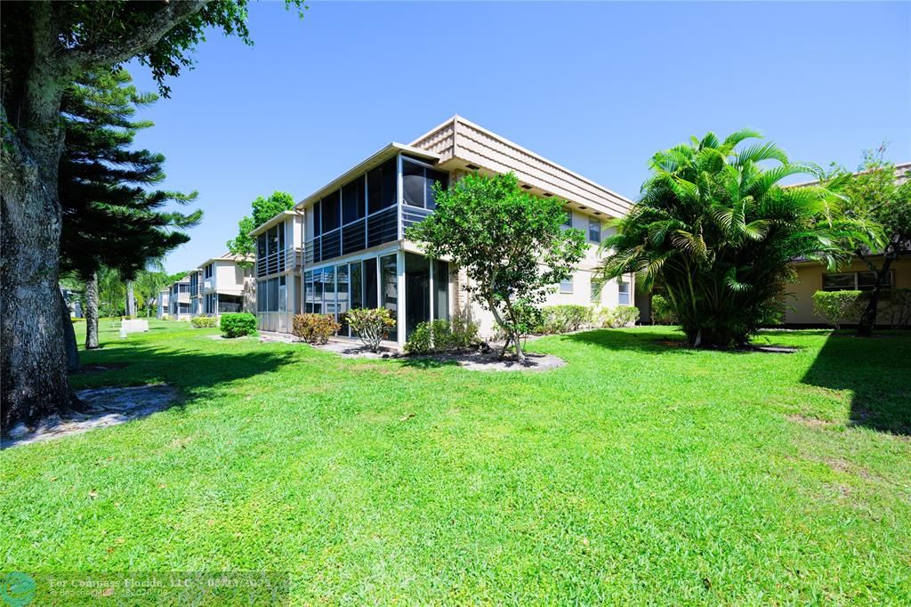 633 Brittany K, Unit 633 Delray Beach, FL 33446 - Photo 15 of 19 a view of a house with a yard