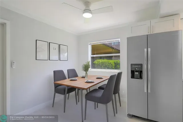a view of a dining room with furniture window and outside view