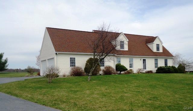 7919 Springhouse Road New Tripoli, PA 18066 - Photo 3 of 22 a front view of house with yard and green space