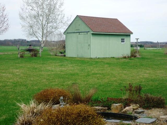 7919 Springhouse Road New Tripoli, PA 18066 - Photo 9 of 22 a backyard of a house with lots of green space