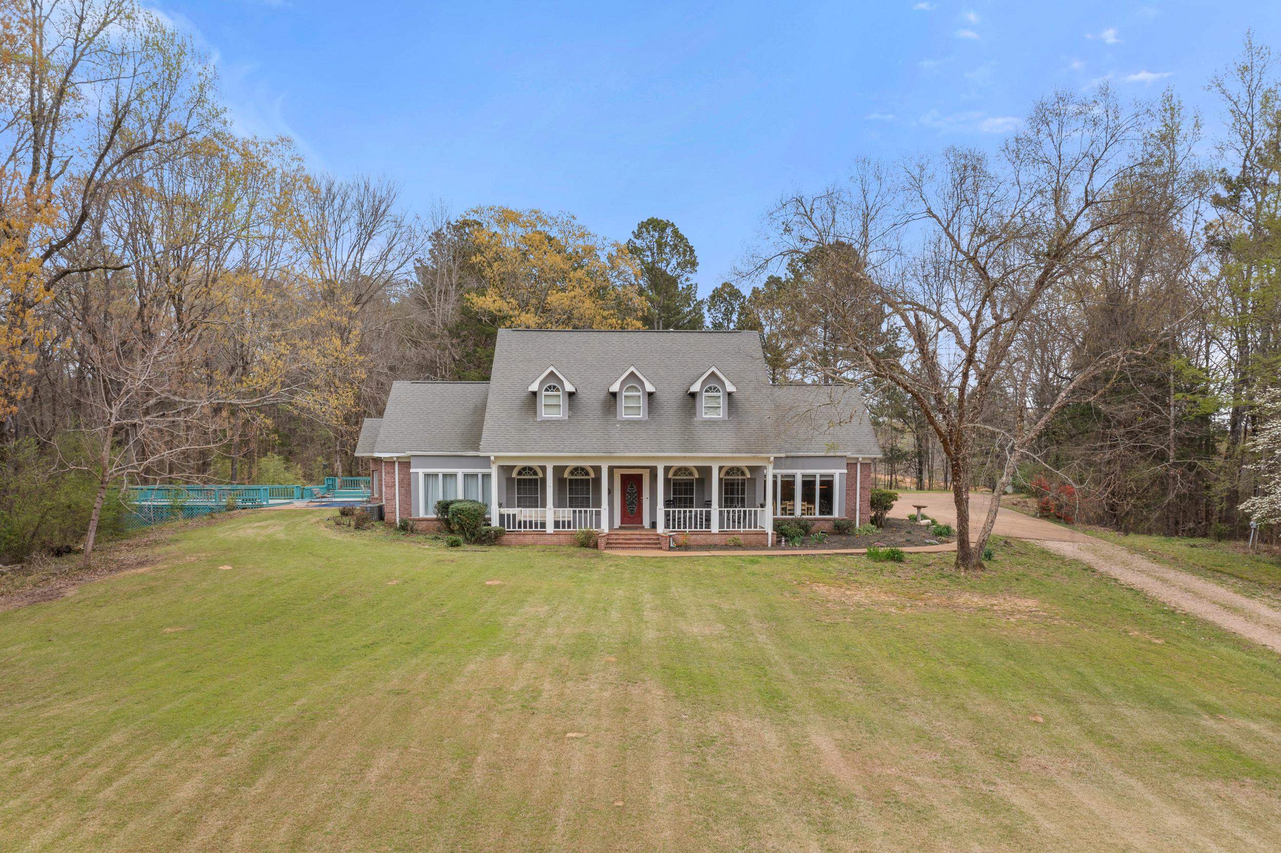 1459 C Vassar Road Pope, MS 38658 - Photo 1 of 40 Cape cod house featuring dirt driveway, covered porch, and a front lawn