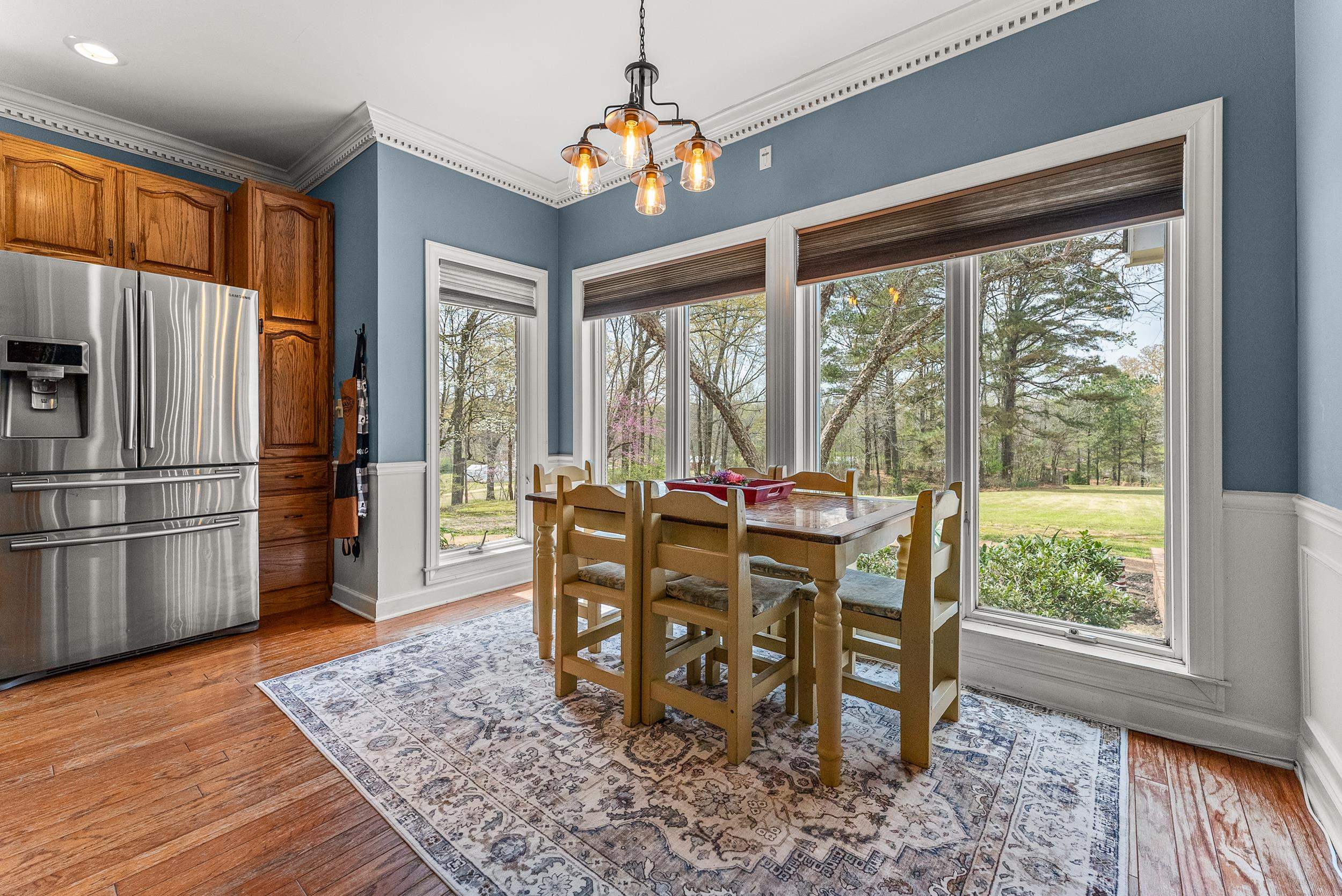 1459 C Vassar Road Pope, MS 38658 - Photo 16 of 40 Dining room featuring a wainscoted wall, ornamental molding, a chandelier, and light wood-style floors
