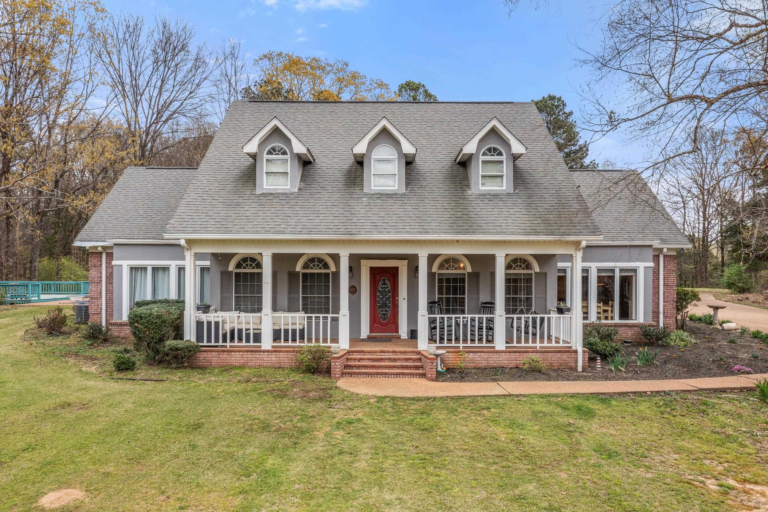 1459 C Vassar Road Pope, MS 38658 - Photo 2 of 40 Cape cod house with brick siding, a porch, a shingled roof, and a front lawn