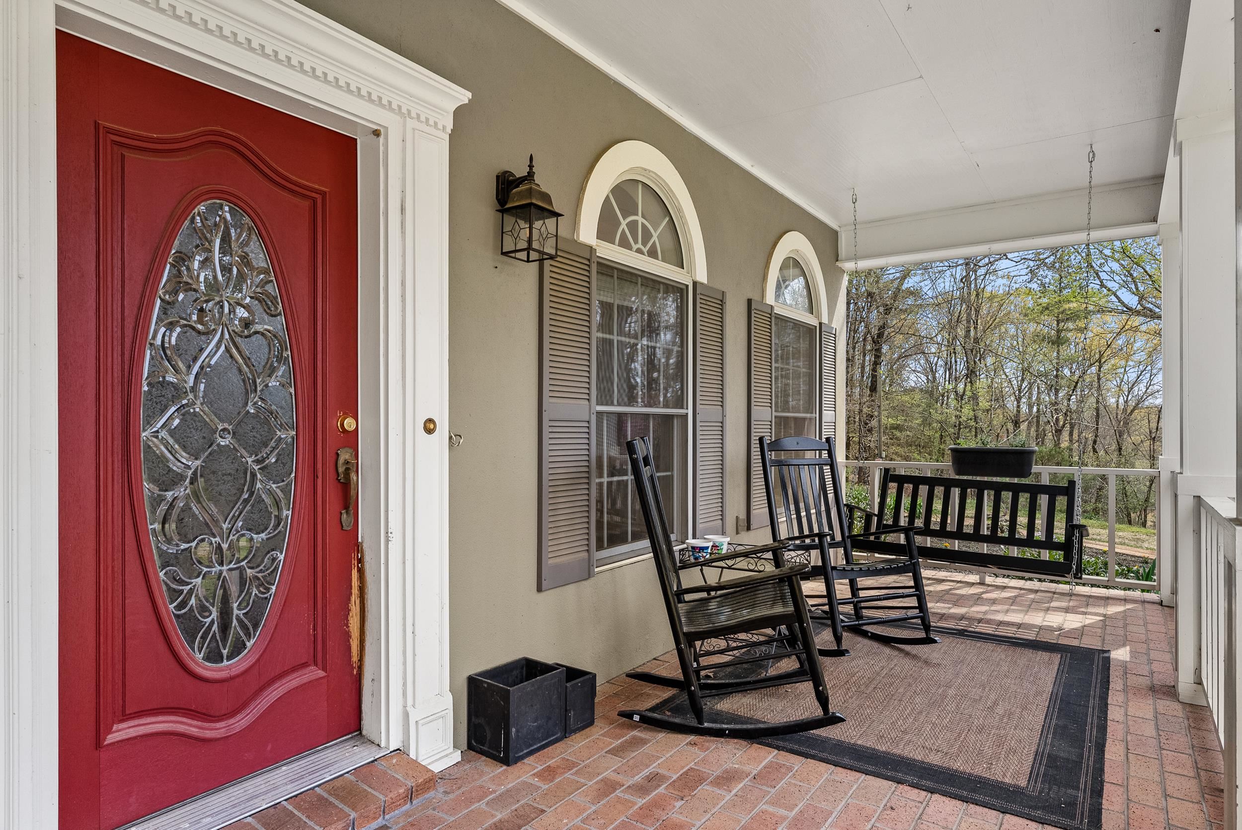 1459 C Vassar Road Pope, MS 38658 - Photo 3 of 40 Doorway to property featuring stucco siding and covered porch