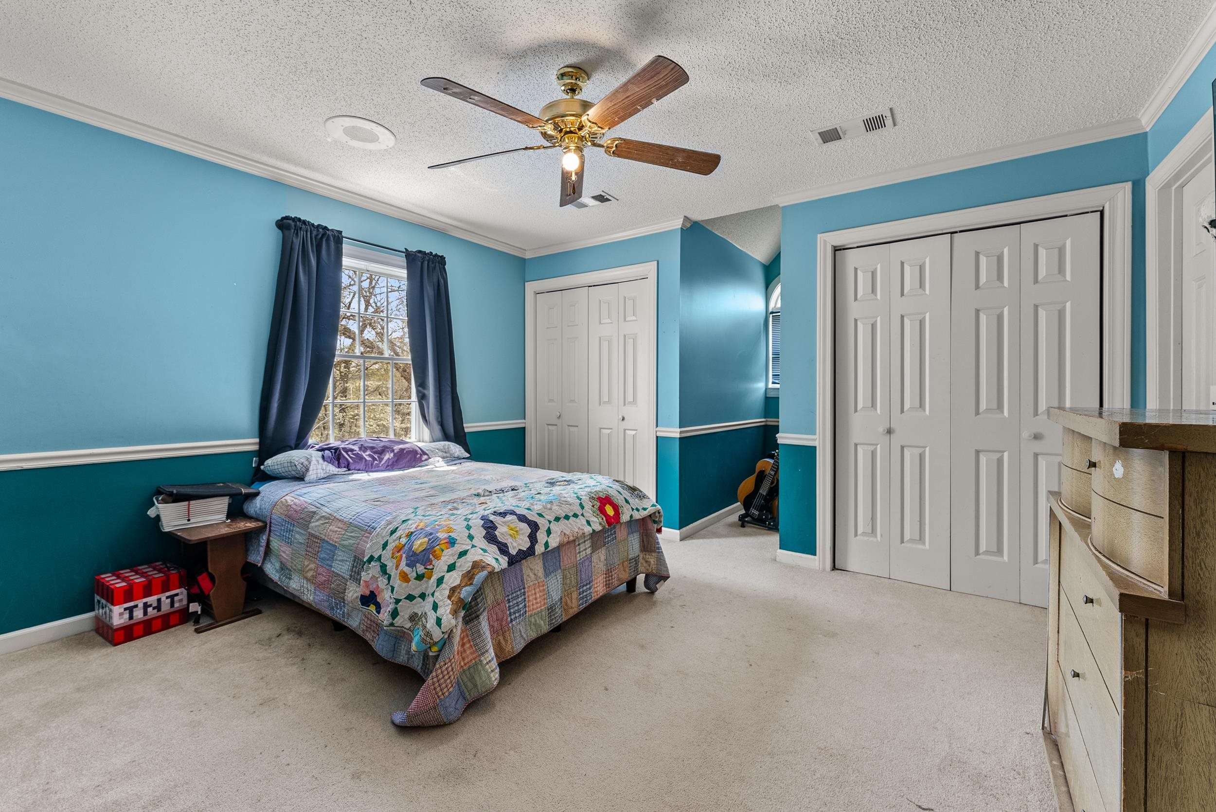1459 C Vassar Road Pope, MS 38658 - Photo 33 of 40 Bedroom featuring two closets, carpet, crown molding, and visible vents
