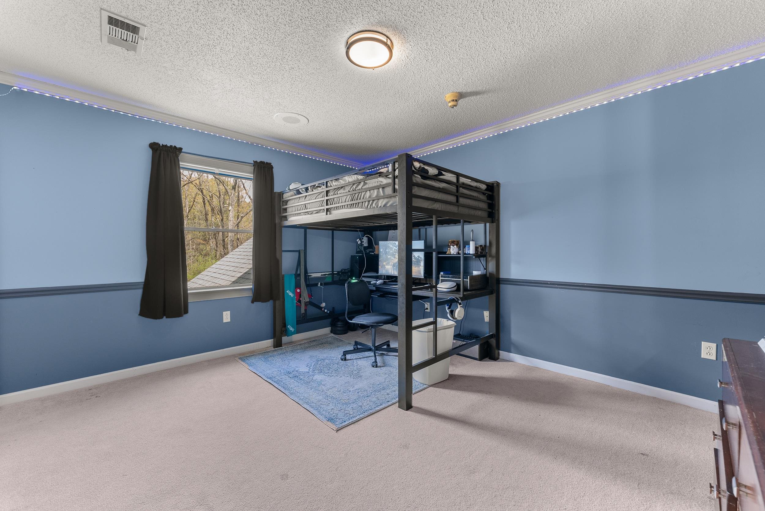 1459 C Vassar Road Pope, MS 38658 - Photo 34 of 40 Bedroom featuring baseboards, visible vents, carpet, and a textured ceiling