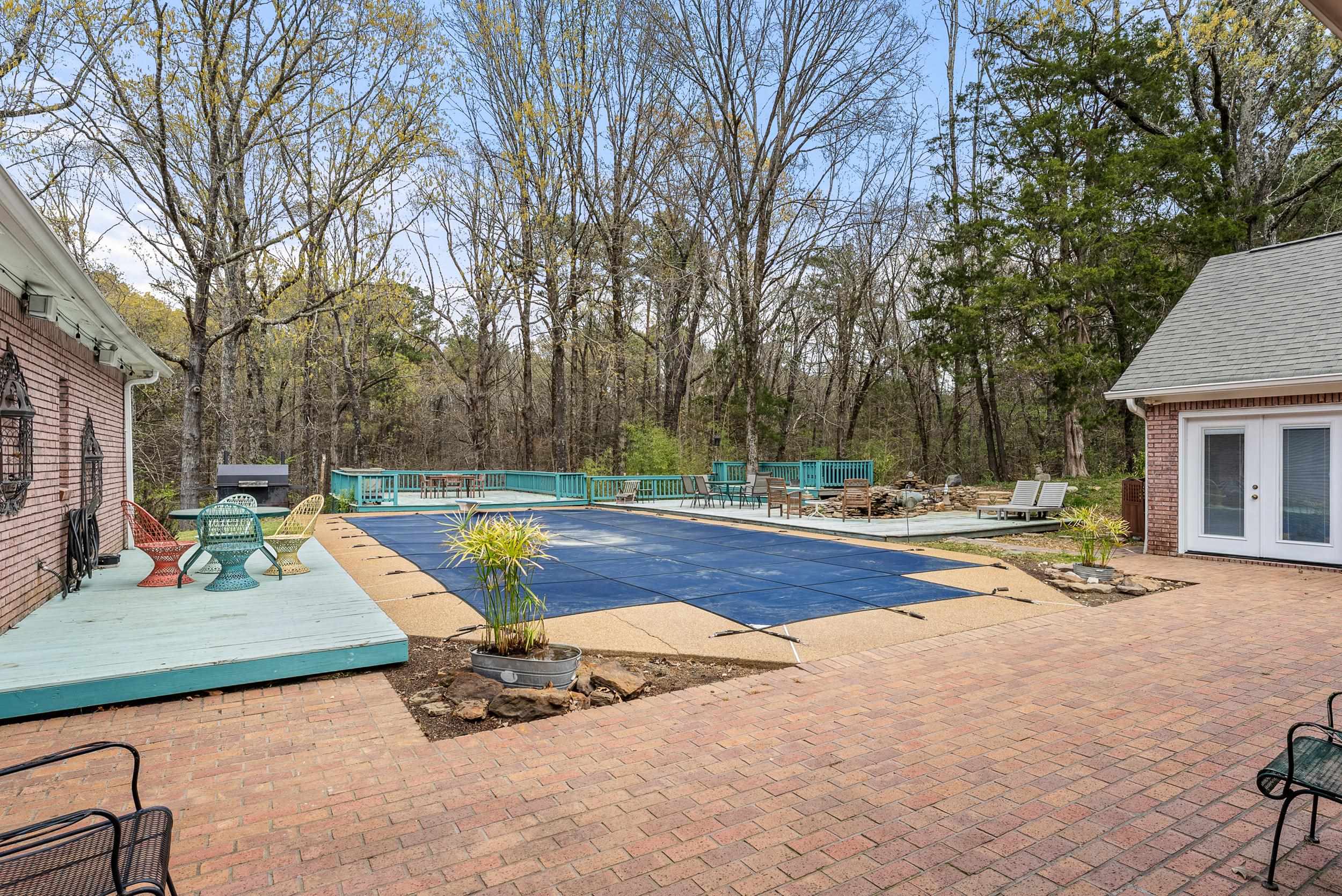1459 C Vassar Road Pope, MS 38658 - Photo 6 of 40 View of swimming pool featuring french doors, a fenced in pool, fence, a deck, and a patio