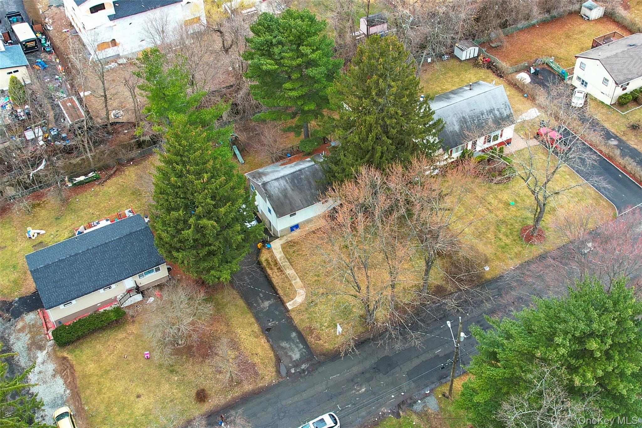 an aerial view of a house with yard swimming pool and outdoor seating