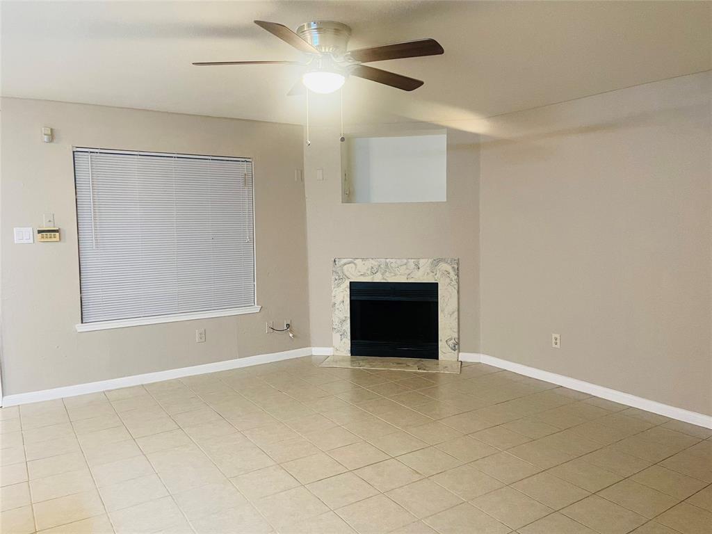 a view of empty room with fireplace