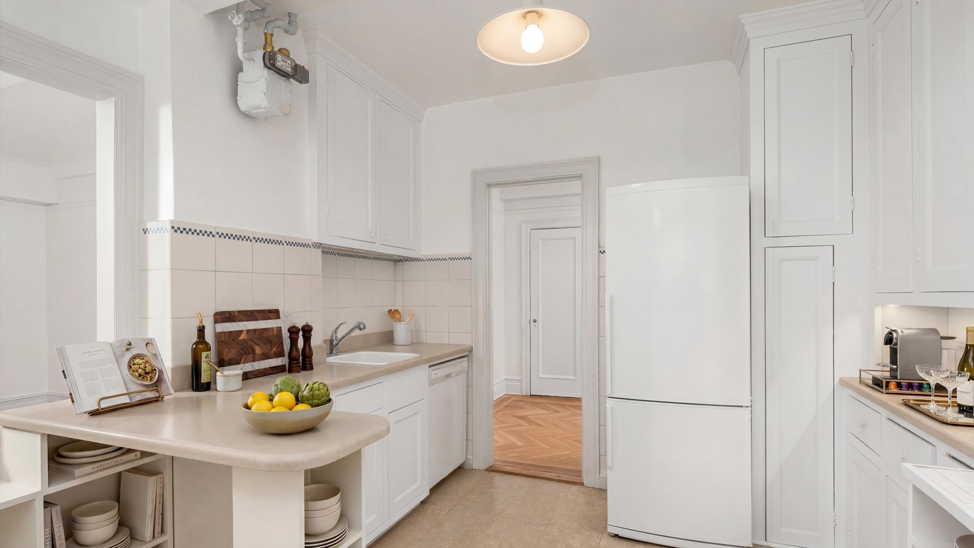 340 Riverside Drive, Unit 6D Manhattan, NY 10025 - Photo 5 of 26 a kitchen with a sink a stove and refrigerator