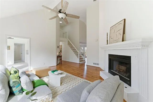 a living room with furniture and a fireplace