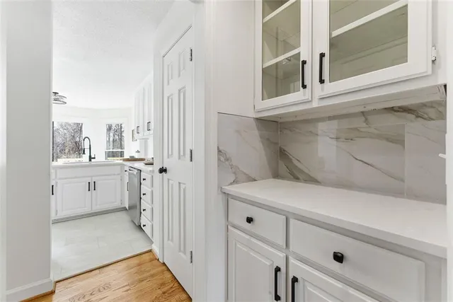 a view of a kitchen with cabinets