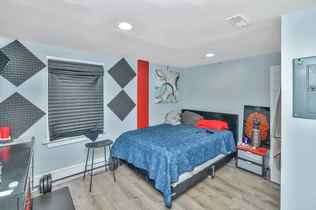 a kitchen filled with lots of clutter and furniture
