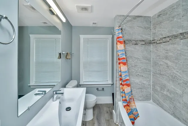 a view of a patio with dining table and chairs