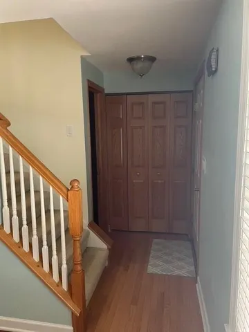 a view of entryway with wooden floor