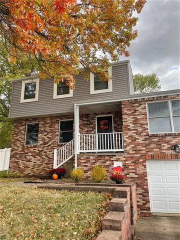 a front view of a house with street
