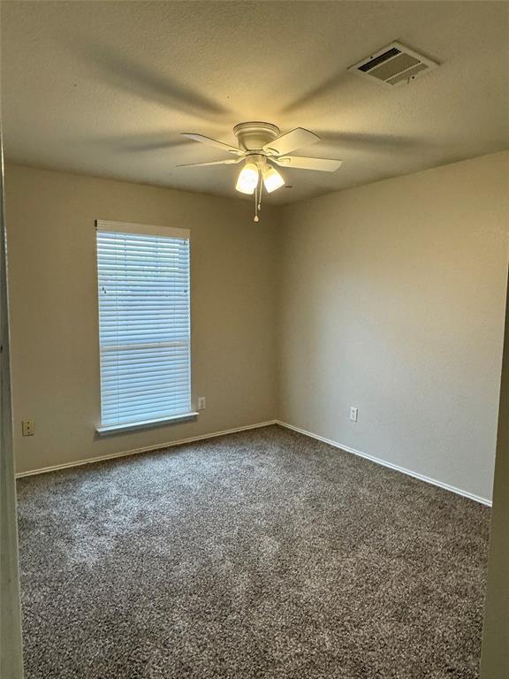 204 South Chestnut Street Forney, TX 75126 - Photo 12 of 19 a view of an empty room with a window