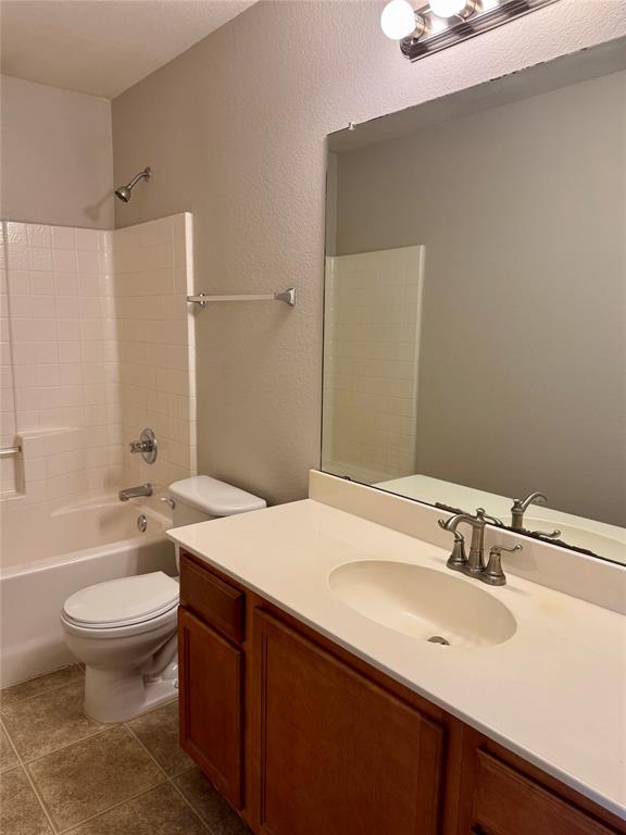 204 South Chestnut Street Forney, TX 75126 - Photo 13 of 19 a bathroom with a sink a toilet and shower