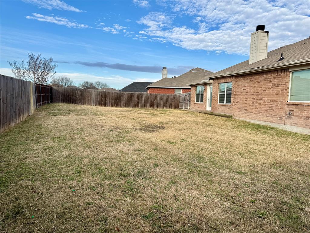 204 South Chestnut Street Forney, TX 75126 - Photo 19 of 19 a front view of a house with a yard
