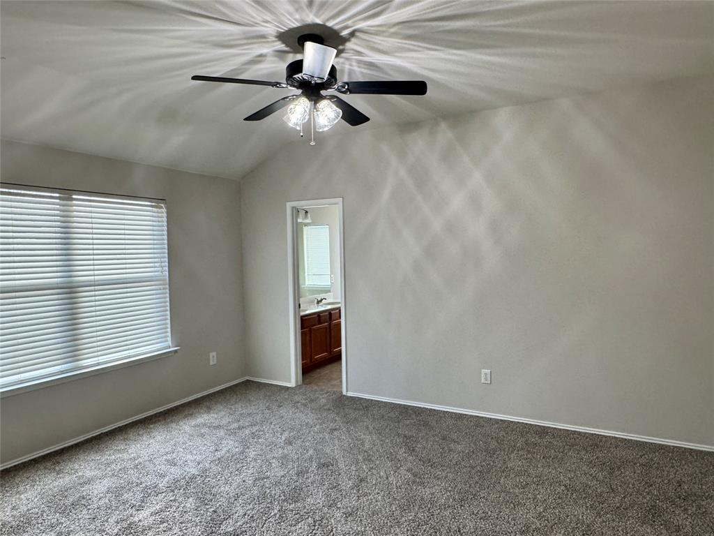 204 South Chestnut Street Forney, TX 75126 - Photo 8 of 19 an empty room with windows and fan