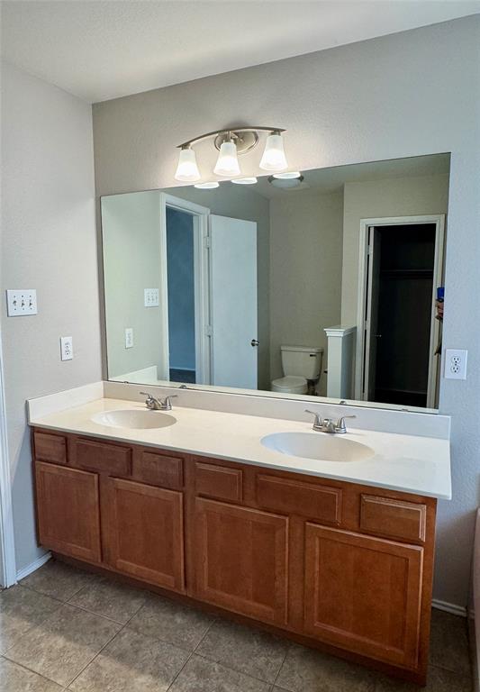 204 South Chestnut Street Forney, TX 75126 - Photo 9 of 19 a bathroom with a sink and a mirror