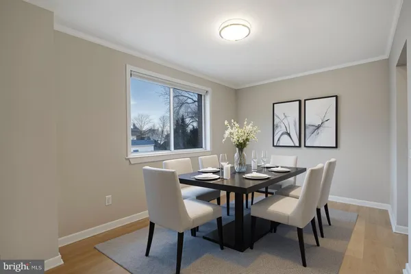 a dining room with furniture and window
