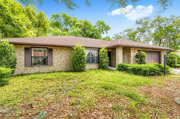 front view of a house with a yard