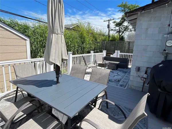 a view of a patio with a table chairs and a patio