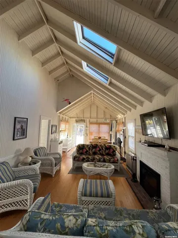a living room with furniture fireplace and a fireplace