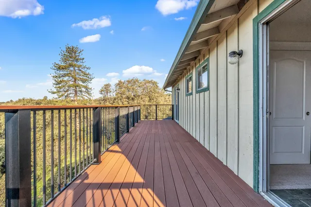 a view of balcony with wooden floor