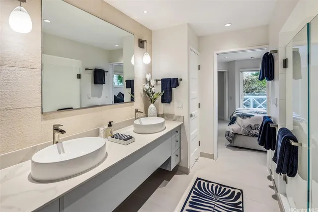 a bathroom with a double vanity sink and a mirror