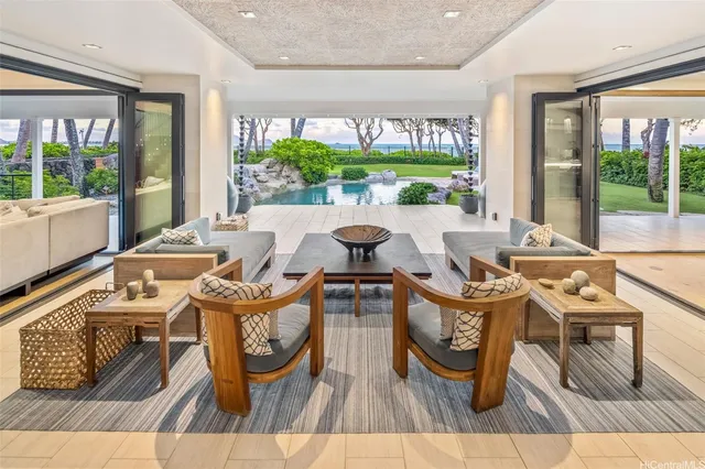 a view of a dining room with furniture large windows and wooden floor