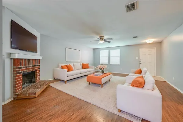 a bedroom with furniture and a fireplace