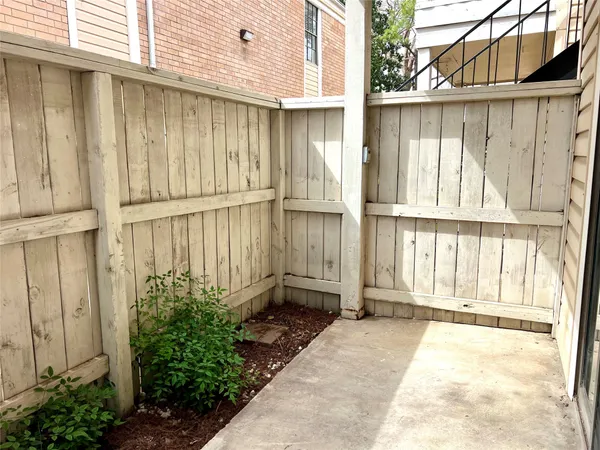 a view of a house with a backyard space