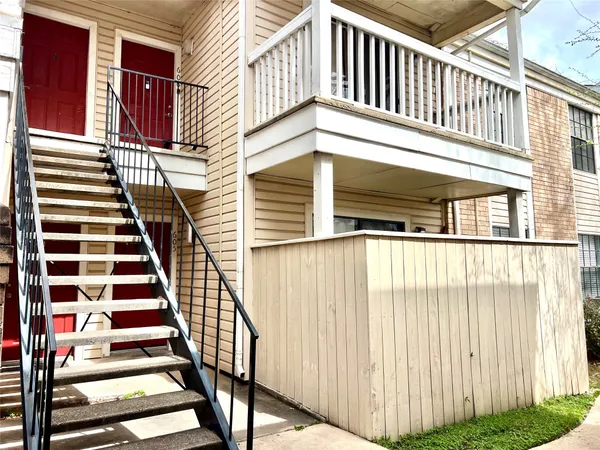 a view of a balcony with staircase