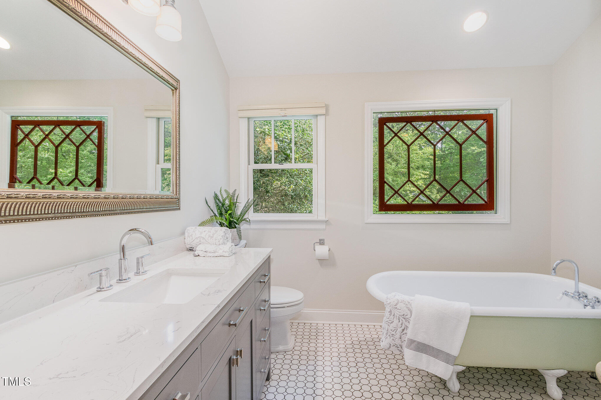 804 Old Mill Road Chapel Hill, NC 27514 - Photo 14 of 30 a bathroom with a tub sink and mirror