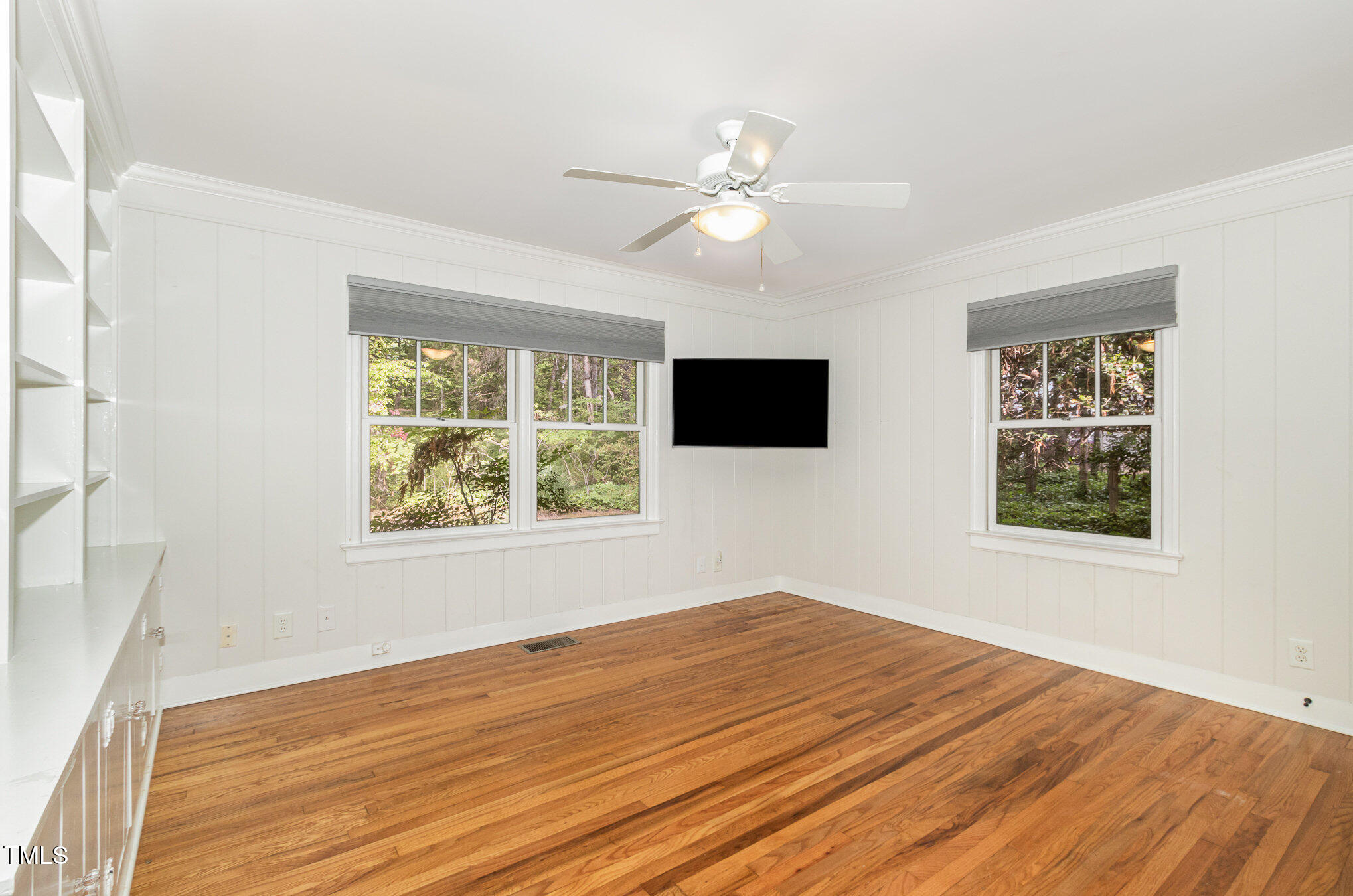 804 Old Mill Road Chapel Hill, NC 27514 - Photo 17 of 30 a view of an empty room with wooden floor and a window