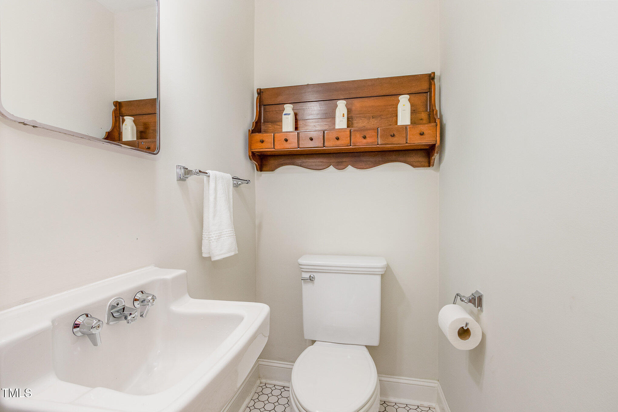 804 Old Mill Road Chapel Hill, NC 27514 - Photo 21 of 30 a white toilet sitting next to a bathroom sink