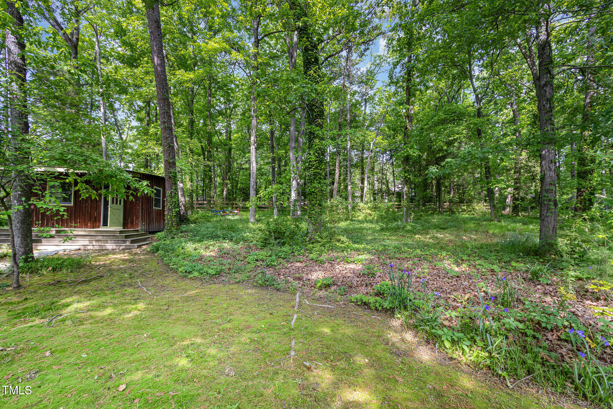 804 Old Mill Road Chapel Hill, NC 27514 - Photo 23 of 30 a backyard of a house with table and chairs
