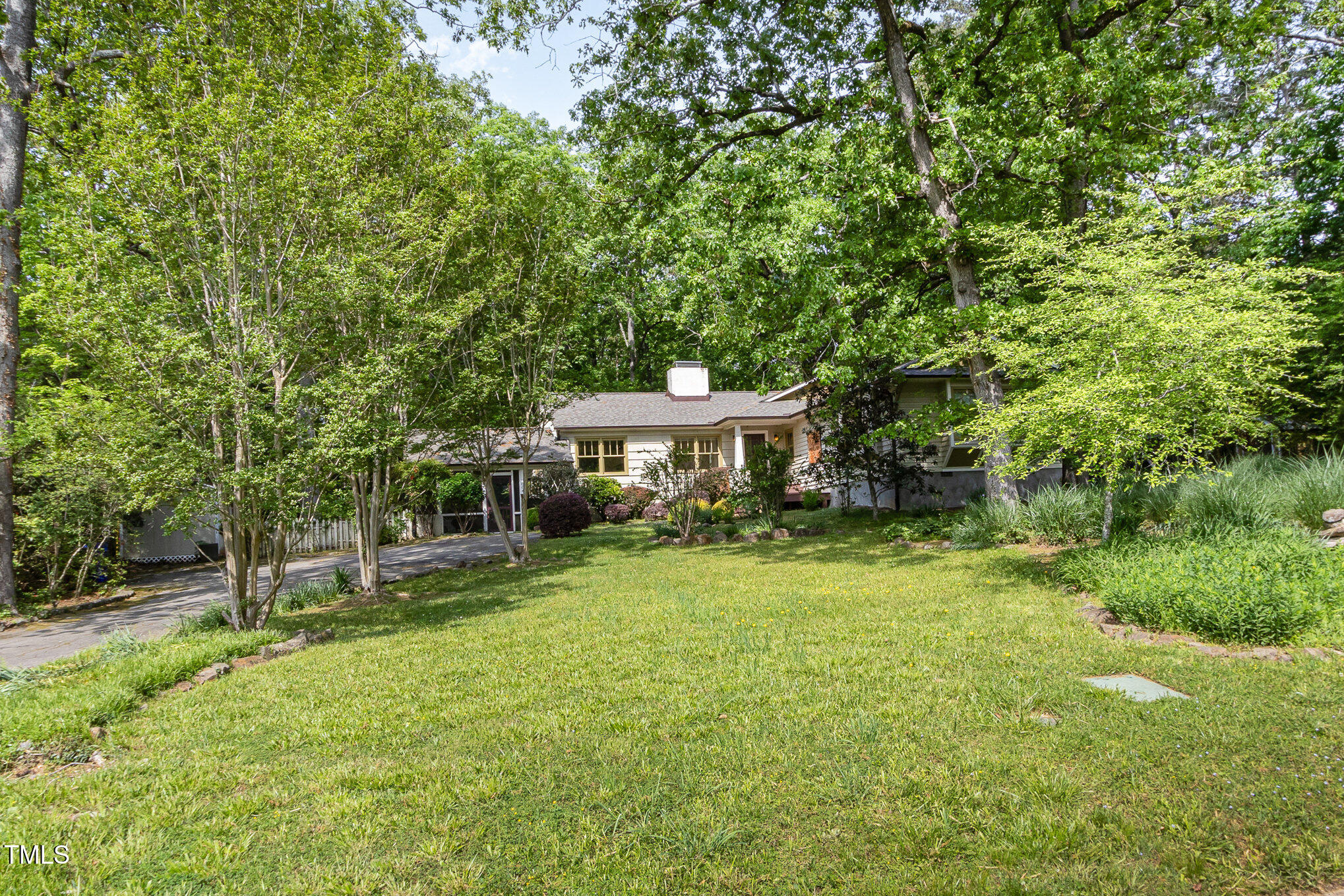 804 Old Mill Road Chapel Hill, NC 27514 - Photo 2 of 30 a backyard of a house with table and chairs