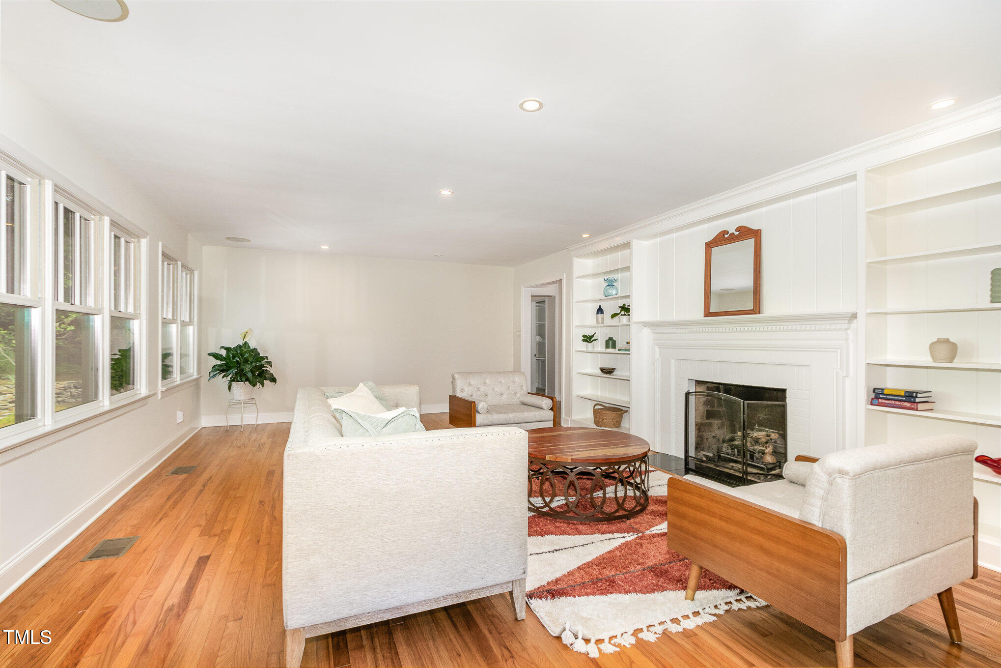 804 Old Mill Road Chapel Hill, NC 27514 - Photo 6 of 30 a living room with furniture fireplace and wooden floor