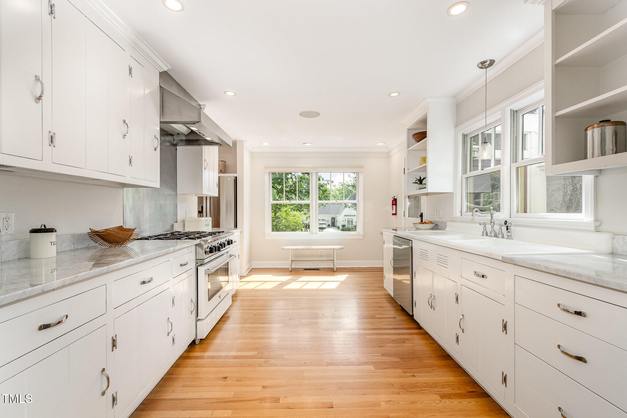 804 Old Mill Road Chapel Hill, NC 27514 - Photo 7 of 30 a large kitchen with stainless steel appliances granite countertop a lot of counter space and a sink
