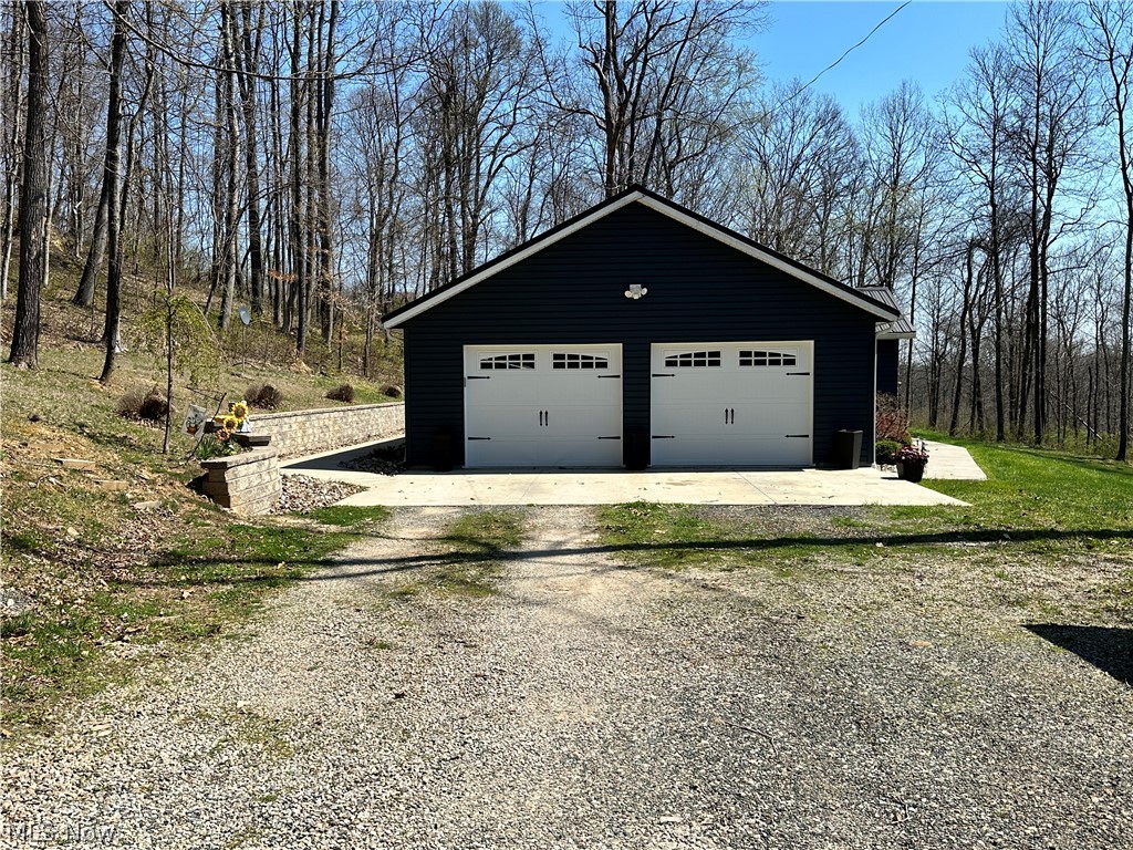26296 Joe Day Road Quaker City, OH 43773 - Photo 3 of 31 view of attached garage from driveway