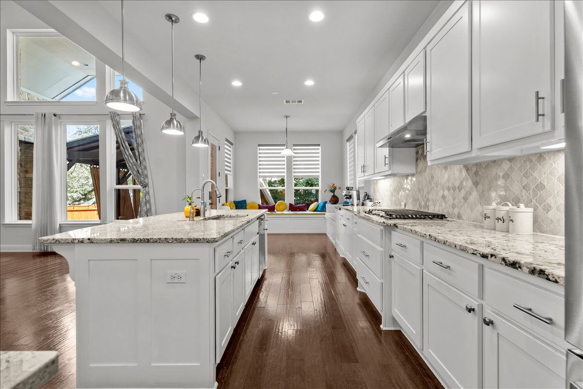 4108 Bison Bend, Unit FOR RENT Cedar Park, TX 78613 - Photo 11 of 36 Culinary delights await in this bright kitchen with granite countertops, sleek cabinetry, and rich hardwood flooring.