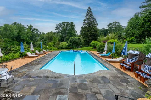 a view of a swimming pool with a lounge chairs