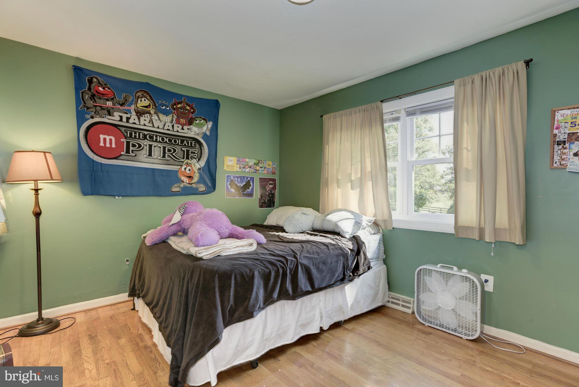 16869 Ivandale Road Hamilton, VA 20158 - Photo 11 of 21 a bedroom with a bed and a painting on the wall
