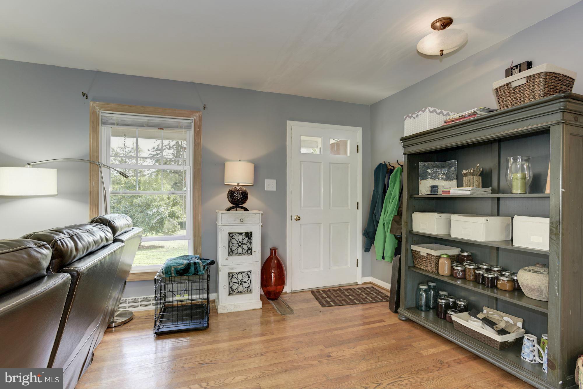 16869 Ivandale Road Hamilton, VA 20158 - Photo 3 of 21 a living room with furniture and a window