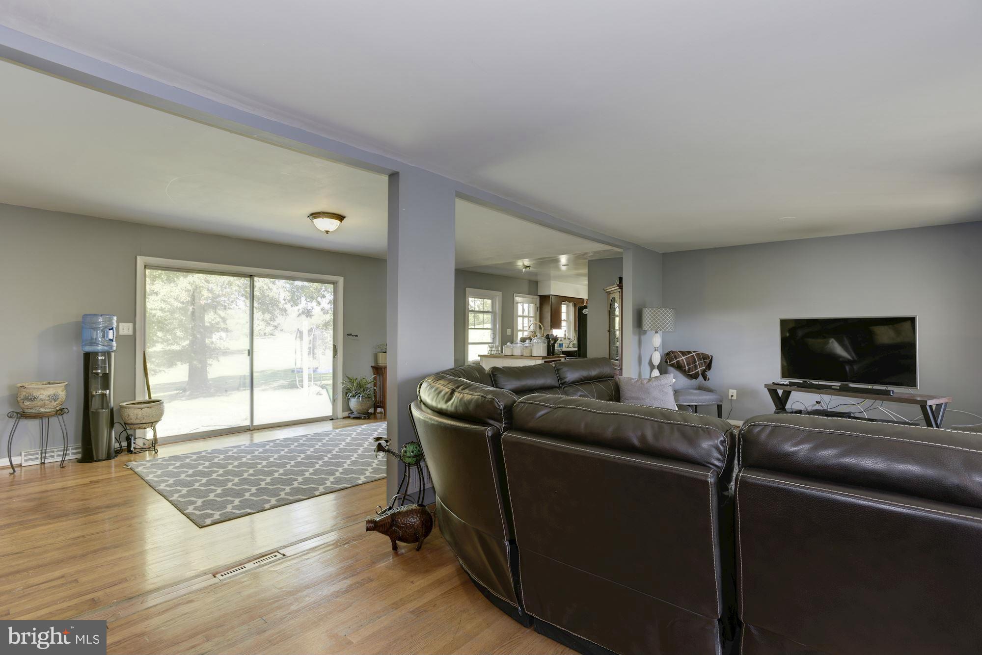 16869 Ivandale Road Hamilton, VA 20158 - Photo 4 of 21 a living room with furniture and a flat screen tv