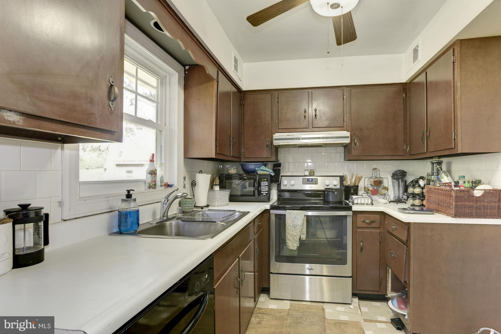 16869 Ivandale Road Hamilton, VA 20158 - Photo 8 of 21 a kitchen with a stove top oven sink and cabinets