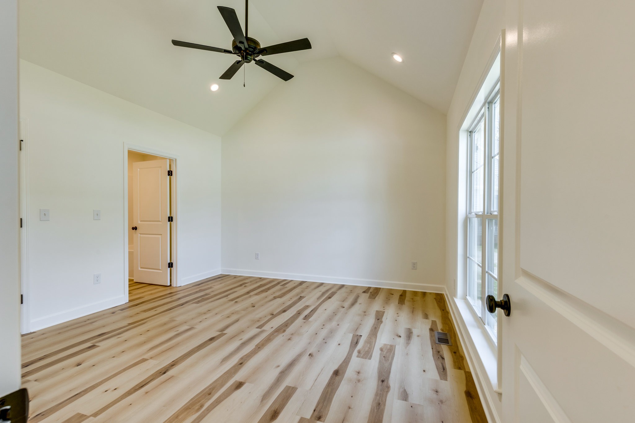 309 Pisgah Rdg Cove Pulaski, TN 38478 - Photo 14 of 43 a view of a livingroom with a hardwood floor and a ceiling fan